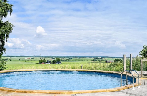 Angelholm House | The cottage is located on a hill where there used to be a windmill.