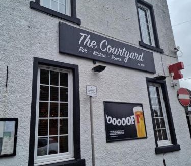 Moffat Hotel | The courtyard bar, kitchen, rooms