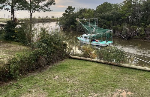 Ocean Springs Cottage | The Fin & Feather. A Gorgeous Seaside Cottage.2 docks. An incredible experience!