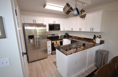 Northglenn House | The "Grandest Little Home" with Garage, 2 Decks, Sun Room, and 2 Person Hot Tub