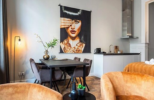 Centrum Apartment | The ground floor studio, spanning 30m2, offers a cozy retreat with a stylish wood herringbone floor
