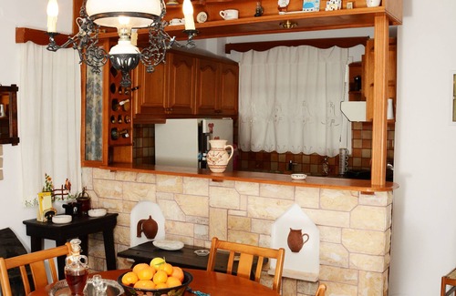 Naxos Apartment | The house is located in the central square of the historical village Kynidaros