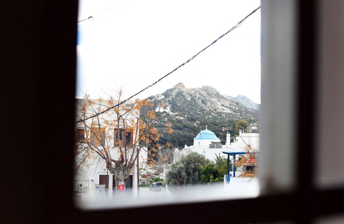 Naxos Apartment | The house is located in the central square of the historical village Kynidaros