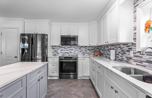 Tranquil Harbour House | The Island House is close to the beach with pool table and hot tub.