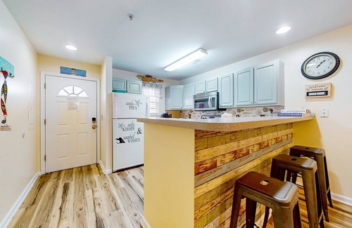 Rehoboth Beach Condo | The Palms water-view condo near beach with outdoor pool, streaming, balcony, AC
