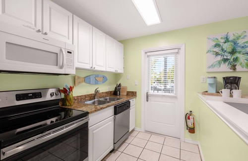 Truman Annex Condo | THE PELICAN PEARL ~ Charming 2 BR/1 Ba Condo in Truman Annex!