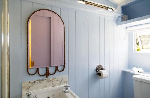 Birdham House | The Showman's Carriage w King Bed close to beach