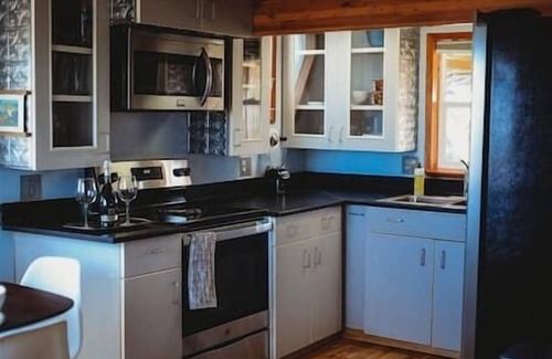 Fairbanks Ski Chalet | This A-frame is surrounded by mountain ranges that you can enjoy from the many windows