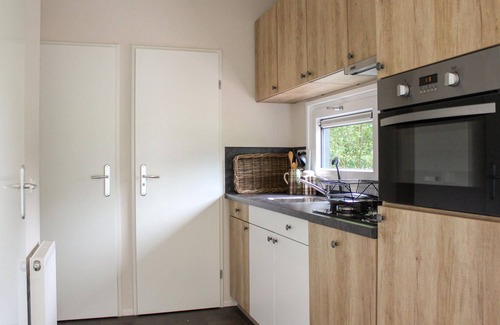 Oosterwolde House | This beautifully decorated vacation home is located in an inviting vacation park, the centerpiece of