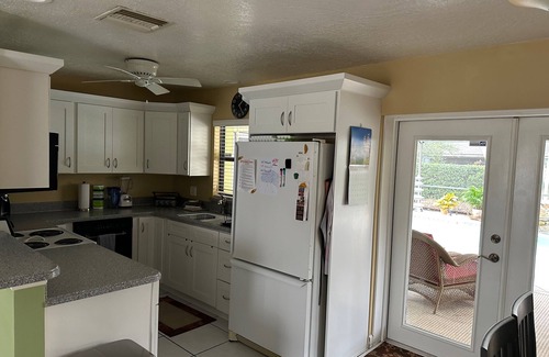 Longwood House | This Charming House with an outdoor pool, 3 bedrooms, 2 full baths.