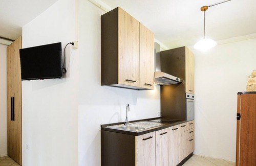 Scansano House | This simply furnished vacation home impresses with its outdoor areas.