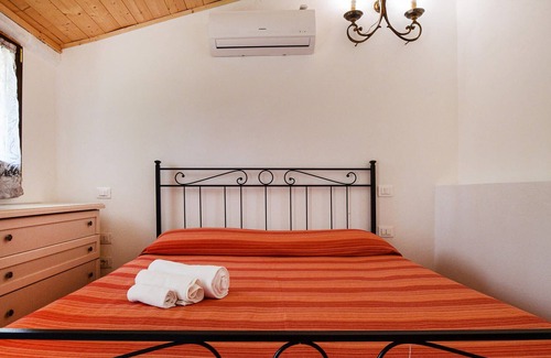 Scansano House | This simply furnished vacation home impresses with its outdoor areas.
