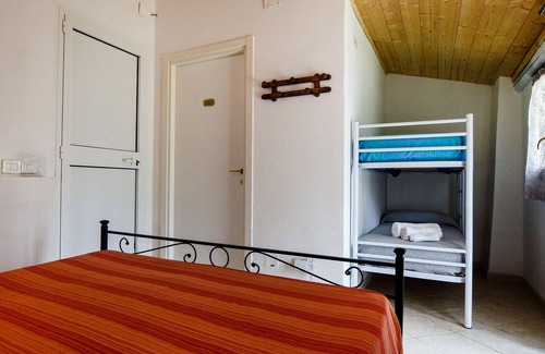 Scansano House | This simply furnished vacation home impresses with its outdoor areas.