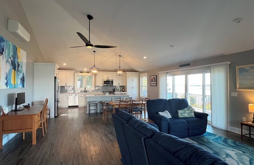 Mid-Coast and Islands House | This spacious home offers a FANTASTIC covered porch, perfect to spend your days gazing at the ocean!