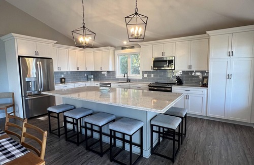 Mid-Coast and Islands House | This spacious home offers a FANTASTIC covered porch, perfect to spend your days gazing at the ocean!
