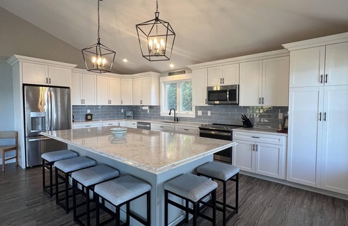 Mid-Coast and Islands House | This spacious home offers a FANTASTIC covered porch, perfect to spend your days gazing at the ocean!