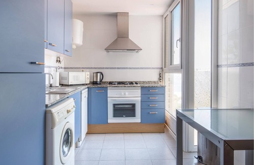 Los Puertos Apartment | This vacation apartment with modern equipment offers a magnificent view of the sea and the huge pool