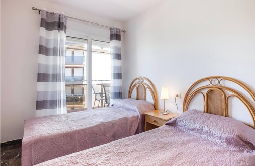 Los Puertos Apartment | This vacation apartment with modern equipment offers a magnificent view of the sea and the huge pool