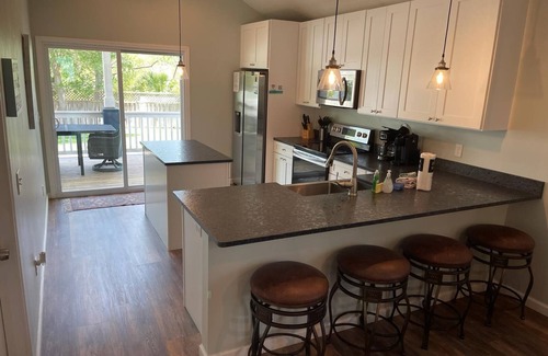 Butler Beach House | Tidal Paradise - Heated Pool & Firepit! Walk to the Beach!