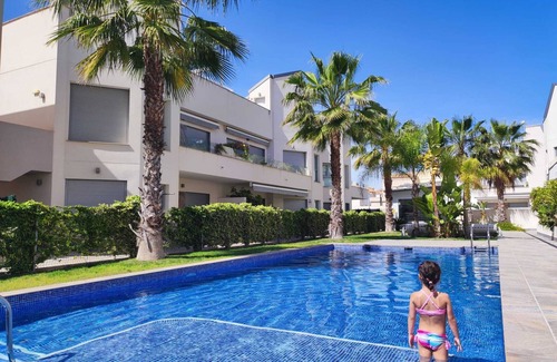 Torrevieja Apartment | Top floor apartment with sunny roof terrace, heated pool and garden