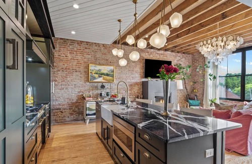 Burnsville Condo | Top Floor condo in Downtown! Elevator Access- Walk to shops and restaurants!