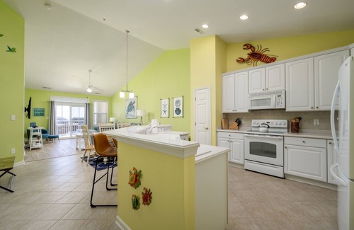 Sunset Island Condo | Top Floor w/water views, Free Linens & Towels! 2 POOLS, Beach Chairs/Beach Cart!