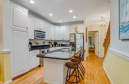 Waters Edge House | Townhouse with marsh & river views - access to crabbing dock & pool