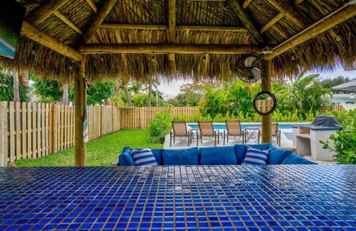 North Palm Beach House | Tradewind Estate: Heated Pool, Tiki Bar, Pool Table