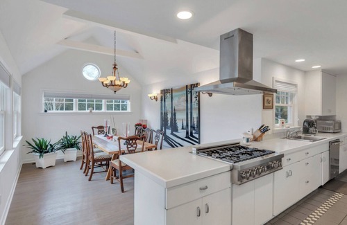 Water Mill House | Traditional-style home with private pool, sweeping back deck, grand lawn,.