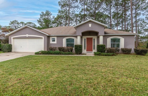 Palm Coast House | Tranquility Awaits! Private Home Backs to trees and wildlife-once a golf course