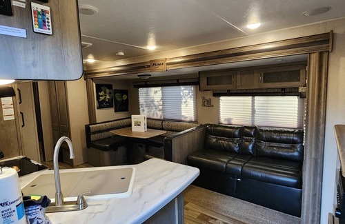 Mill Spring House | Travel trailer near the creek, short walk to pool and playground, indoor and outdoor kitchenette, sleeps 8.