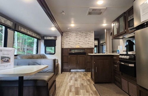 Mill Spring House | Travel trailer near the creek, short walk to pool and playground, sleeps 8.
