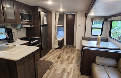 Mill Spring House | Travel trailer near the creek, short walk to pool and playground, sleeps 8.