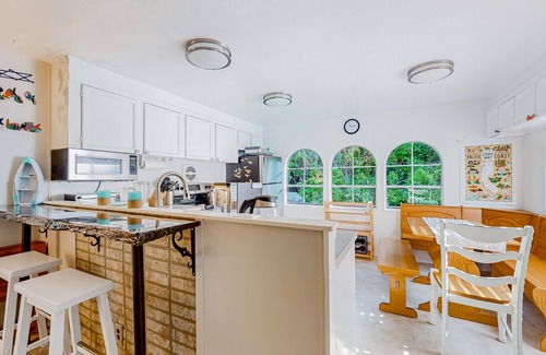 Florence House | Tree-lined coastal home with children's items, gas grill, and washer/dryer