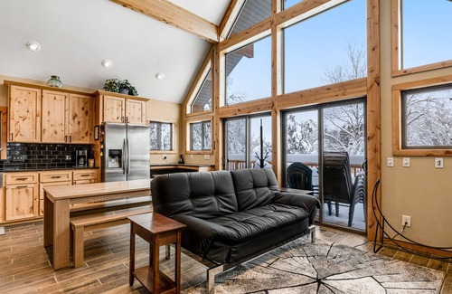 Nekoosa House | Tree-surrounded cabin with lake views, kayaks, wood-burning fireplace, & W/D