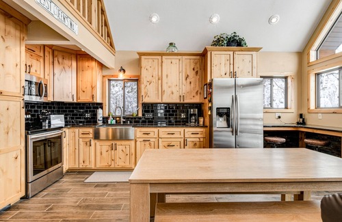 Nekoosa House | Tree-surrounded cabin with lake views, kayaks, wood-burning fireplace, & W/D