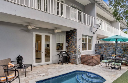 Sailboat Bend House | Tropical Fun Downtown! Spacious, courtyard, sweet pool, game room, walkable area
