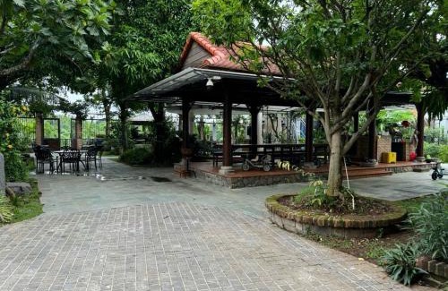 District 9 Villa | Tropical Riverfront Pool House