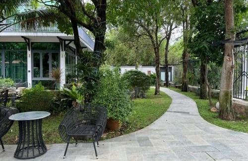 District 9 Villa | Tropical Riverfront Pool House