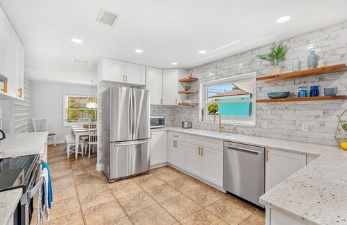 Seacoast Shores House | Tropical Retreat: Indian Harbour Beach Home with BBQ Grill, Fire Pit, Private Pool & Hot Tub! 🌴