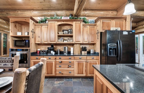 Pittman Center Cabin | True Log Cabin 2 acres, hot tub, fire pit, stream, all king suites