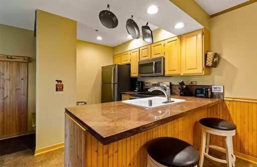 Peak 8 Condo | True Ski-in Ski-Out at Snowflake Chair Lift with Hot Tubs and Fireplace 715 sqft