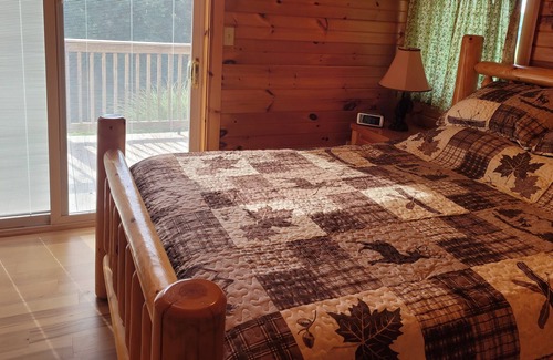 Kerr Cabin | Twin Oaks is a rustic and pet friendly cabin located on 50 mostly wooded acres