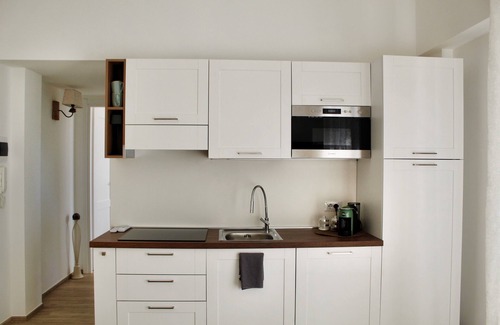 Bordighera Apartment | Two-room apartment surrounded by greenery, with large terrace overlooking the sea and private parking space,