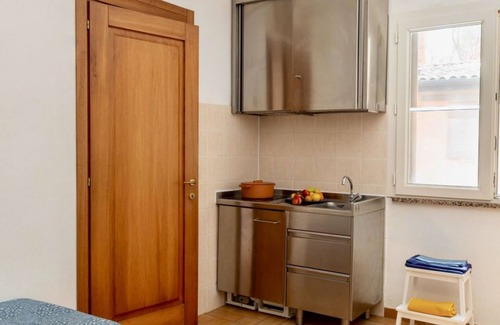 Talamone Apartment | Two-room brick apartment of approximately 35 m2 on the ground floor or first floor with air conditioning surrounded by vegetation, composed of a living room with flat-screen television, two single beds and a kitchenette equipped with stove, fridge with f