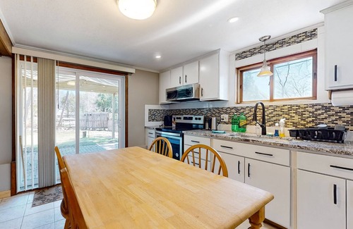 Sandown House | Two-story dog-friendly home with a lake view, deck, gas grill