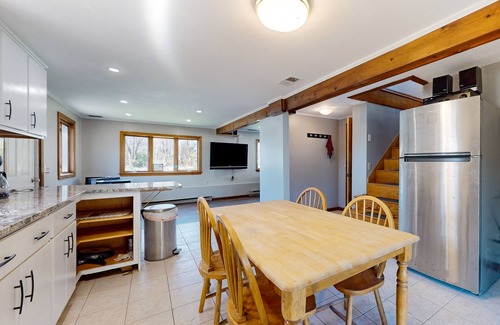 Sandown House | Two-story dog-friendly home with a lake view, deck, gas grill