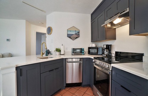 Manistee Condo | Two Story HV Condo with Water Views