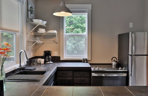 Langley Condo | Two-story townhouse just steps from the waters edge with a private deck. Perfect accommodations for families. Recently remodeled. Beautifully appointed