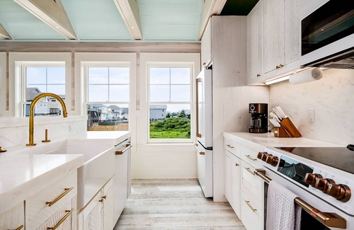 Kitty Hawk House | Unique coastal home & pool house with private pool and retro finishes
